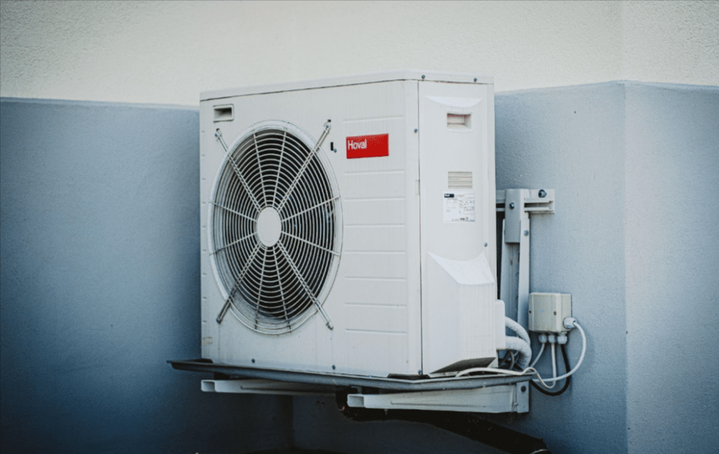 at home ac unit installed on the corner of a home