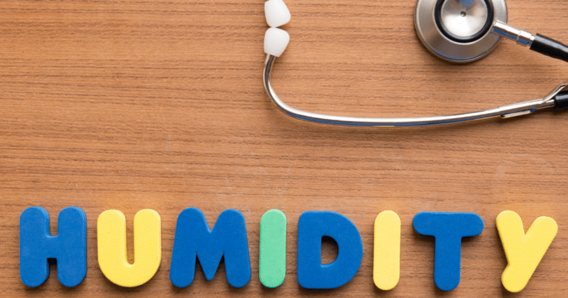 humidity spelled out in a bubble letters with a stethoscope in the background