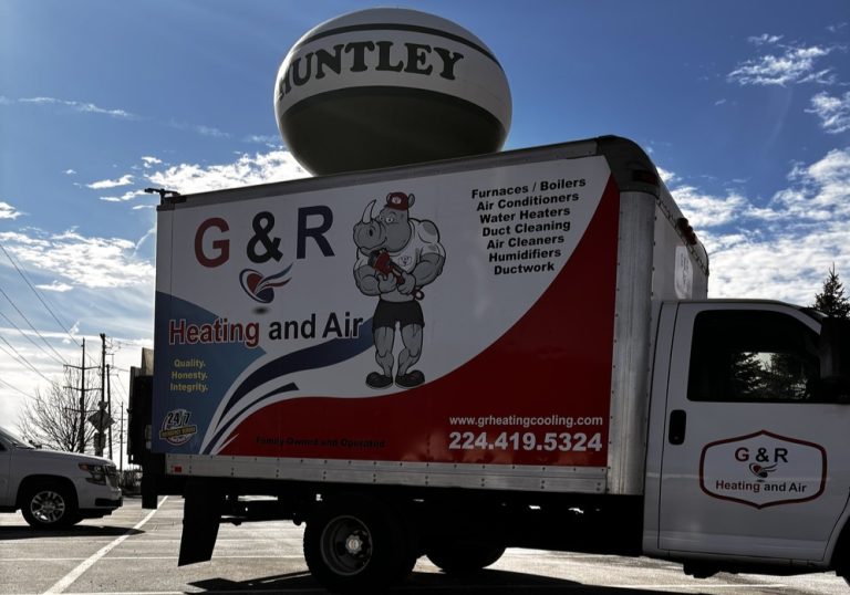 G&R Heating and Air Truck in front of Huntley, IL Water Tower