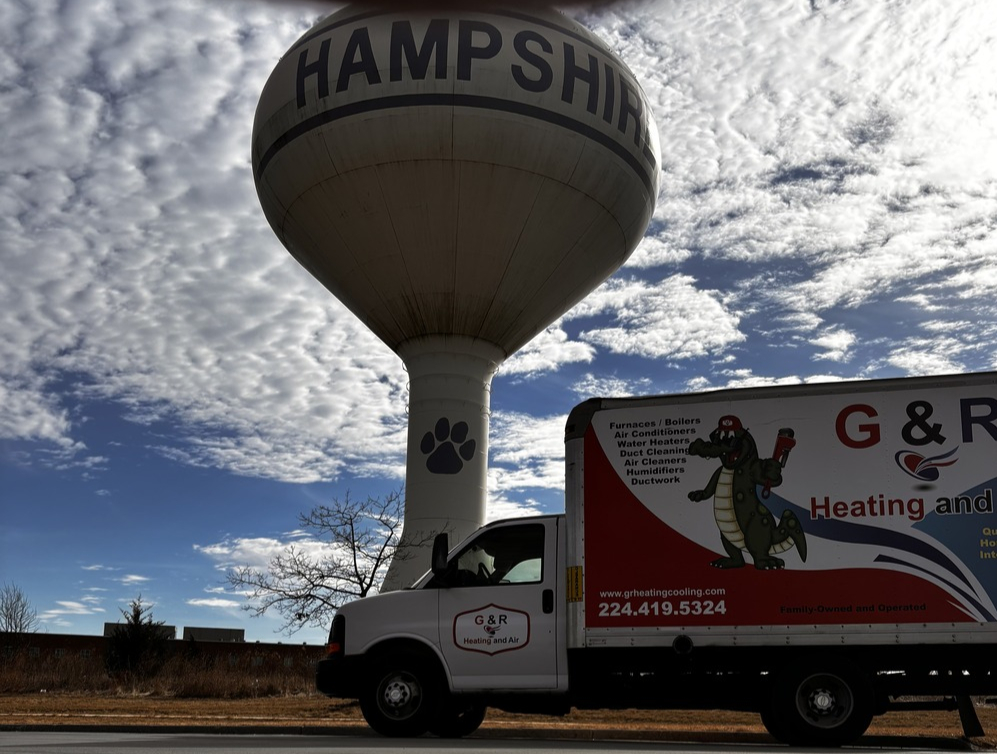 G&R Heating and Cooling Truck in front of Hampshire, IL Water Tower