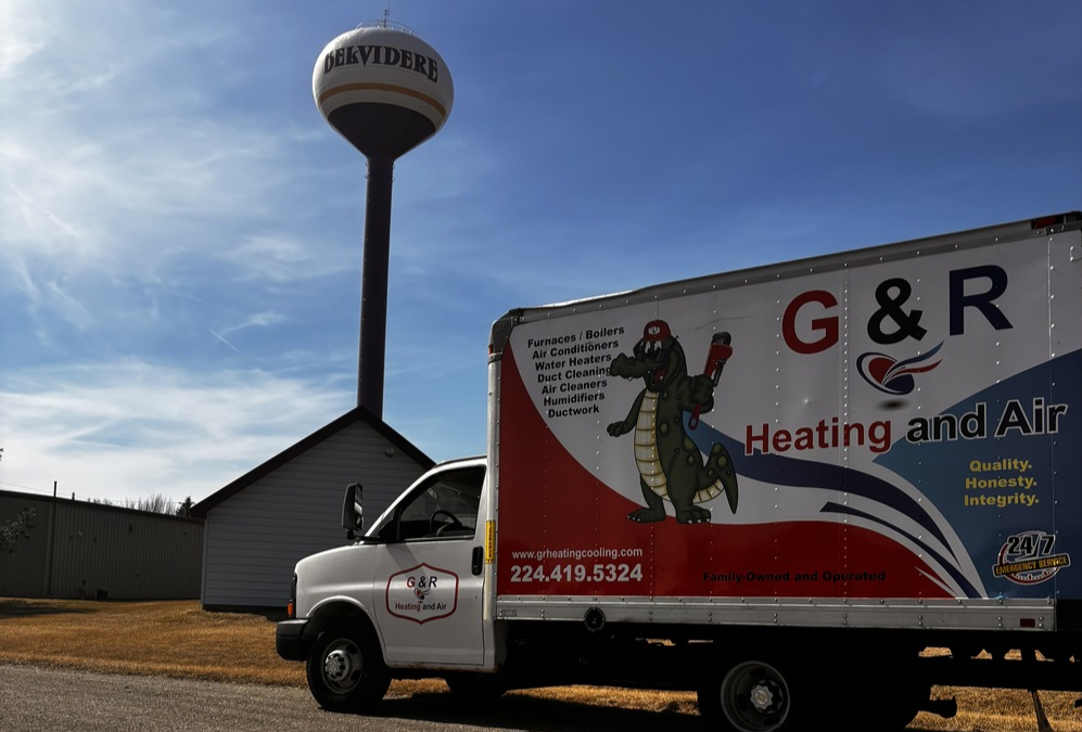 G&R Heating and Air Truck in front of Belvidere, IL Water Tower