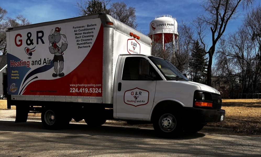 G&R Heating and Air Truck in front of Loves Park, IL Water Tower