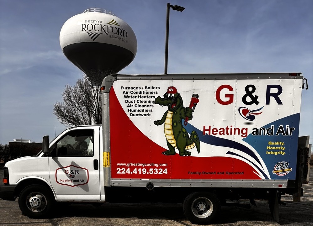 G&R Heating and Air Truck in front of Rockford, IL Water Tower
