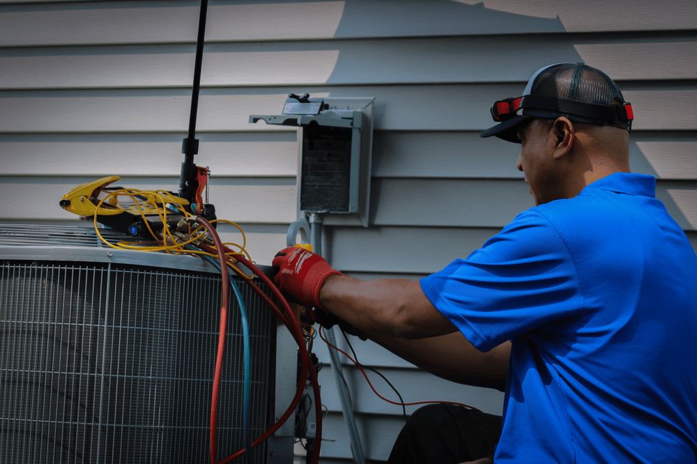 G & R Tech Working on AC Unit